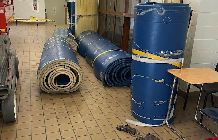Photo of rolled up wrestling mats